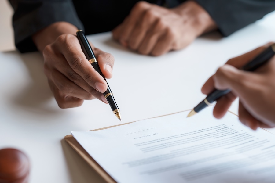 business agreement signed with pens on white paper 2026 01 08 06 21 09 utc