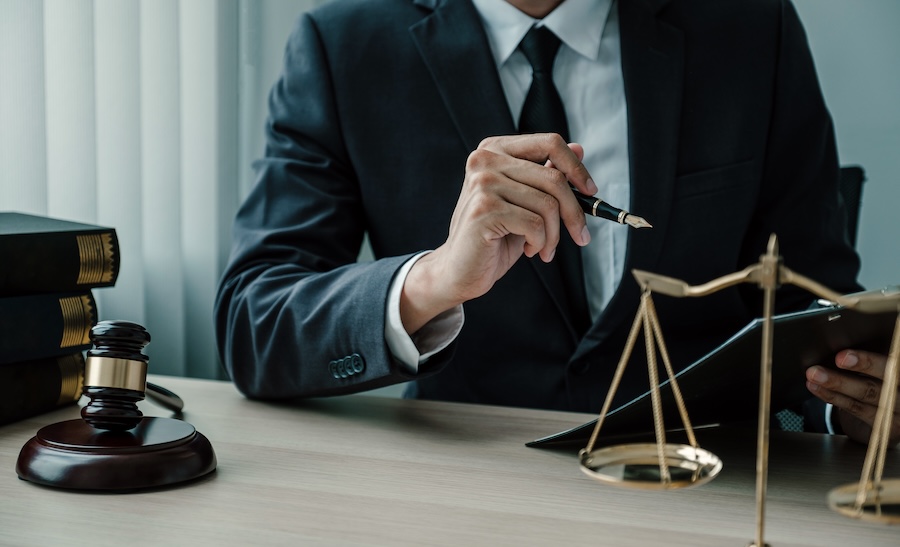 lawyer hand holding pen and providing legal consul 2026 01 08 00 30 59 utc