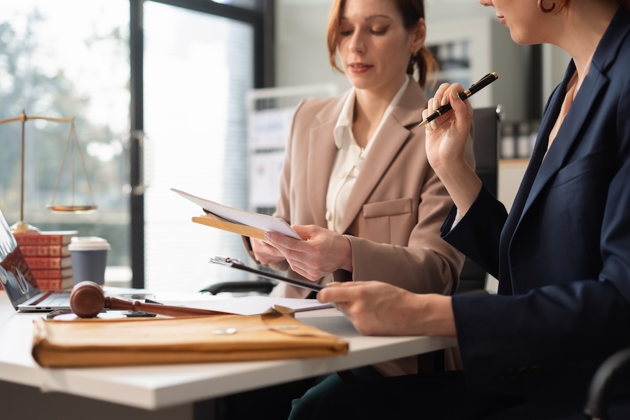 professional women in office discussing legal matt 2026 01 09 10 22 26 utc