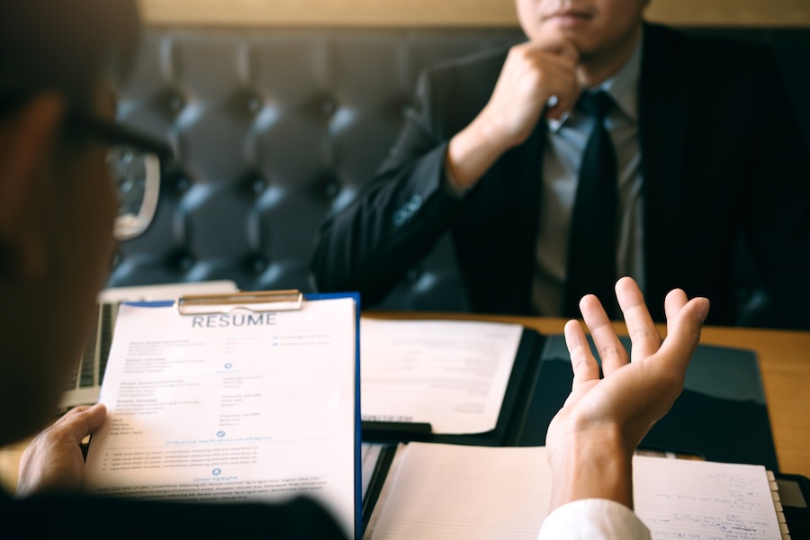 serious meeting reviewing resume in professional s 2026 01 06 09 28 56 utc